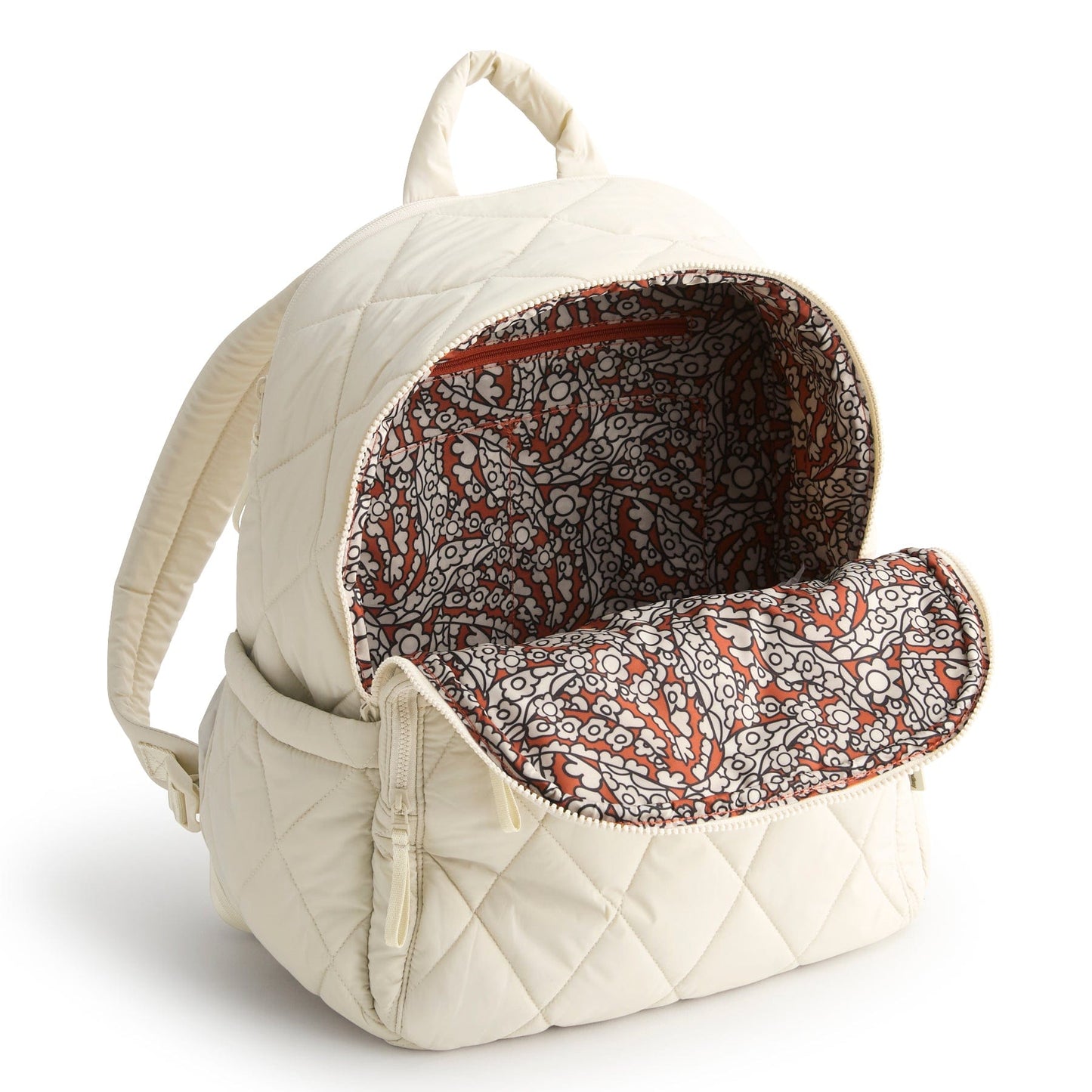 Quilted beige backpack with floral pattern interior on a white background